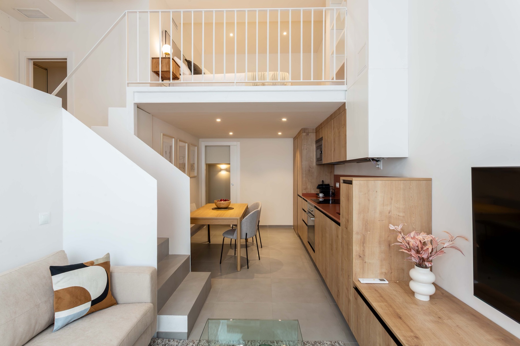 Split-level Akora loft apartment with a mezzanine bedroom in central Madrid